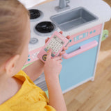 KidKraft Uptown Pastel Wooden Play Kitchen – Chalkboard, Play Phone & See-Through Doors