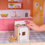 KidKraft So Darling Wooden Dollhouse on Wheels – 2 Levels, 4 Rooms, Lights, Sounds & 29 Accessories