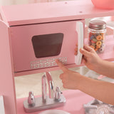 KidKraft Vintage Wooden Play Kitchen – Pink Retro Design, Working Knobs & Toy Phone