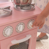 KidKraft Vintage Wooden Play Kitchen – Pink Retro Design, Working Knobs & Toy Phone