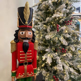 Haute Decor 37" Red and Green Christmas Nutcracker Resin Statue with Hand-Carved Wood Look